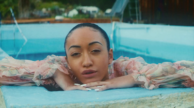 a woman laying in a pool of water