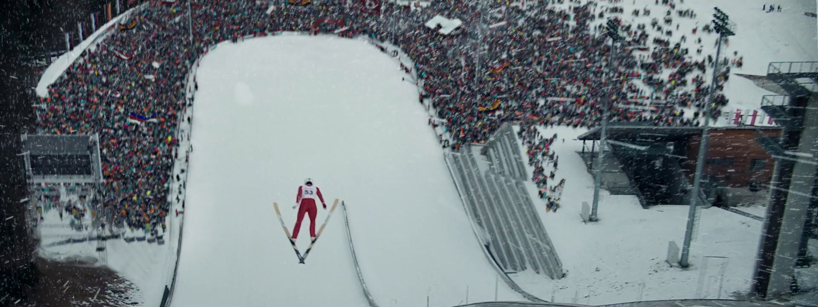 a person skiing down a snow covered ski slope