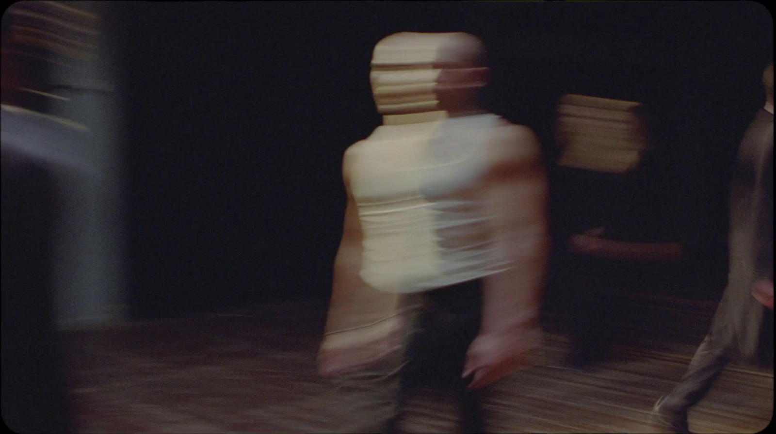 a blurry image of a person walking in a room