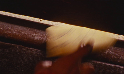 a banana being peeled on a wooden surface