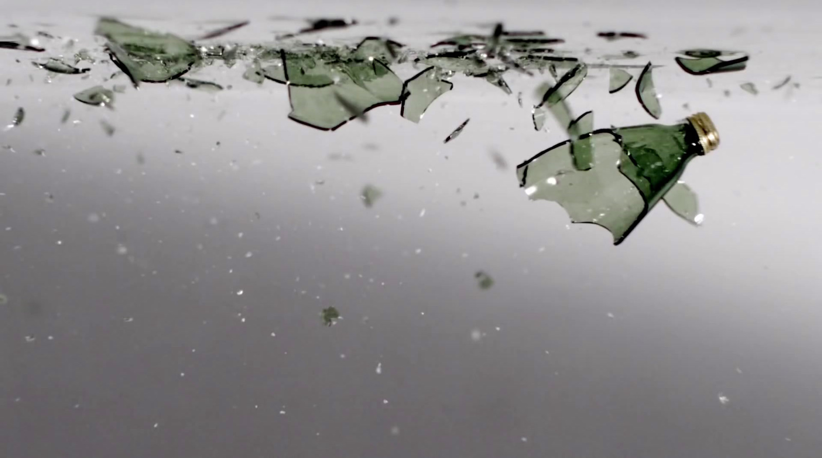 a group of broken glass sitting on top of a table