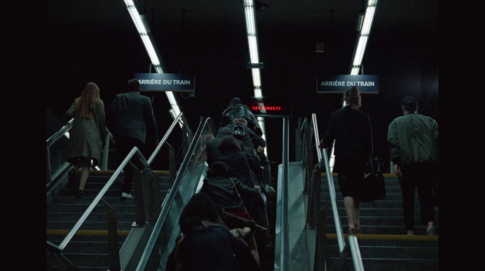 a group of people walking down a flight of stairs