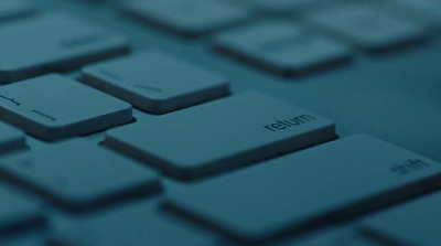 a close up of a computer keyboard with a blurry background