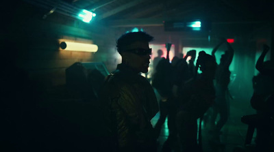 a group of people standing in a dark room