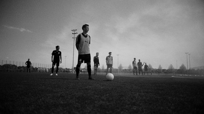 a group of men playing a game of soccer