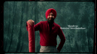 a man in a red turban holding a red umbrella