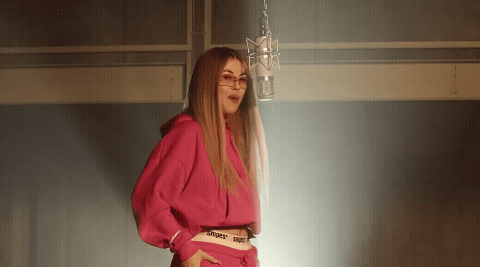 a woman in a pink shirt and pink pants