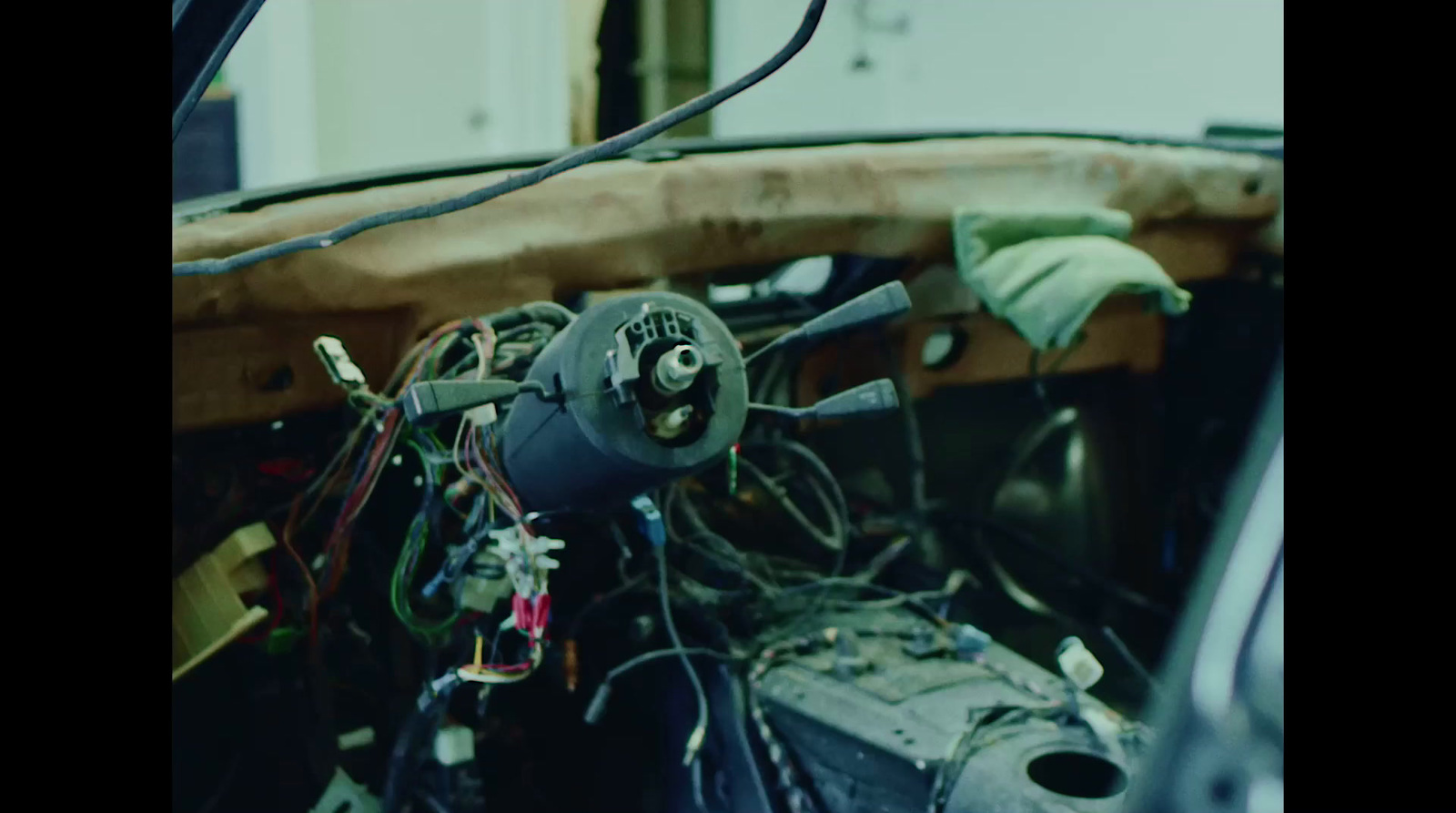 a close up of a car dashboard with wires and wires