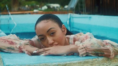 a woman laying down in a pool of water