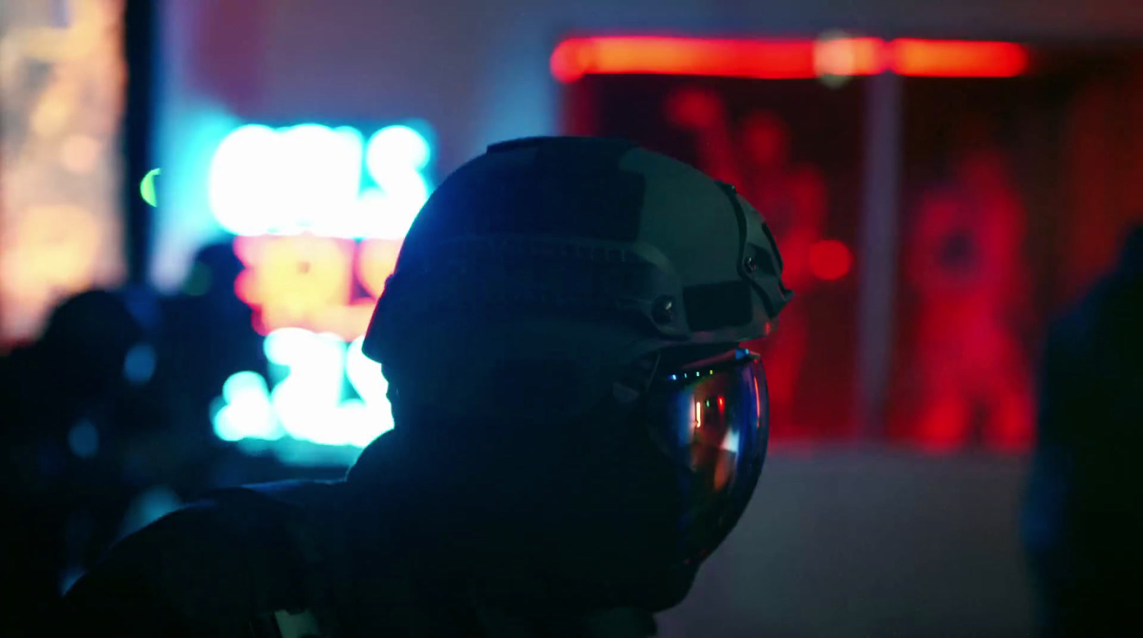 a person wearing a helmet in a dark room