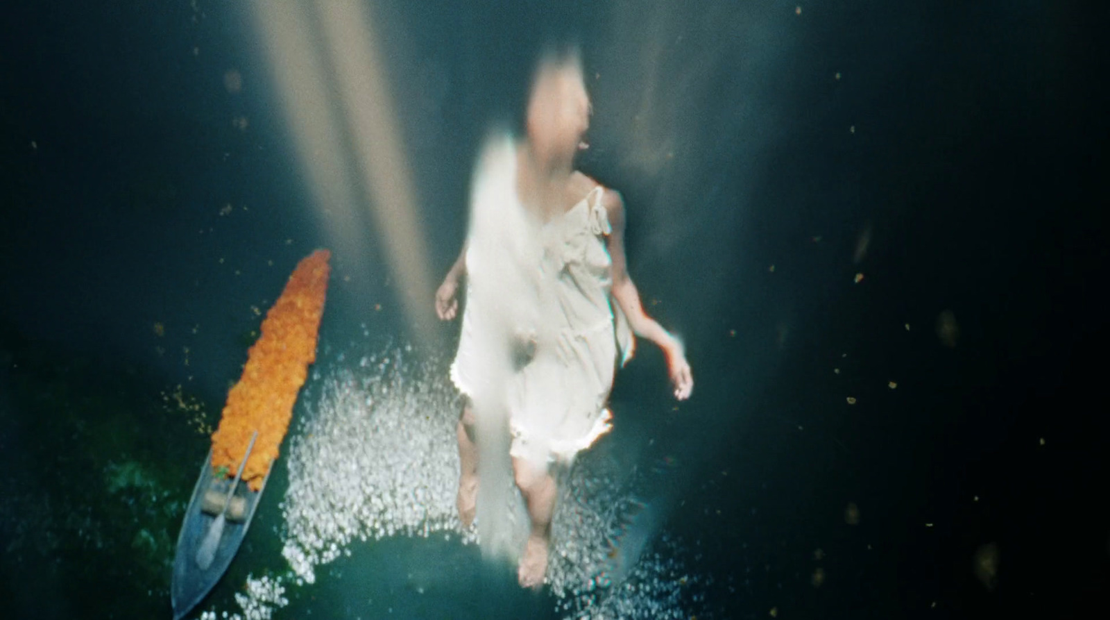 a blurry photo of a person in a white dress and a surfboard