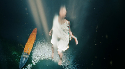 a blurry photo of a person in a white dress and a surfboard