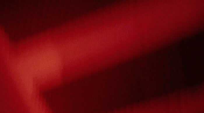 a close up of a red cloth with a blurry background