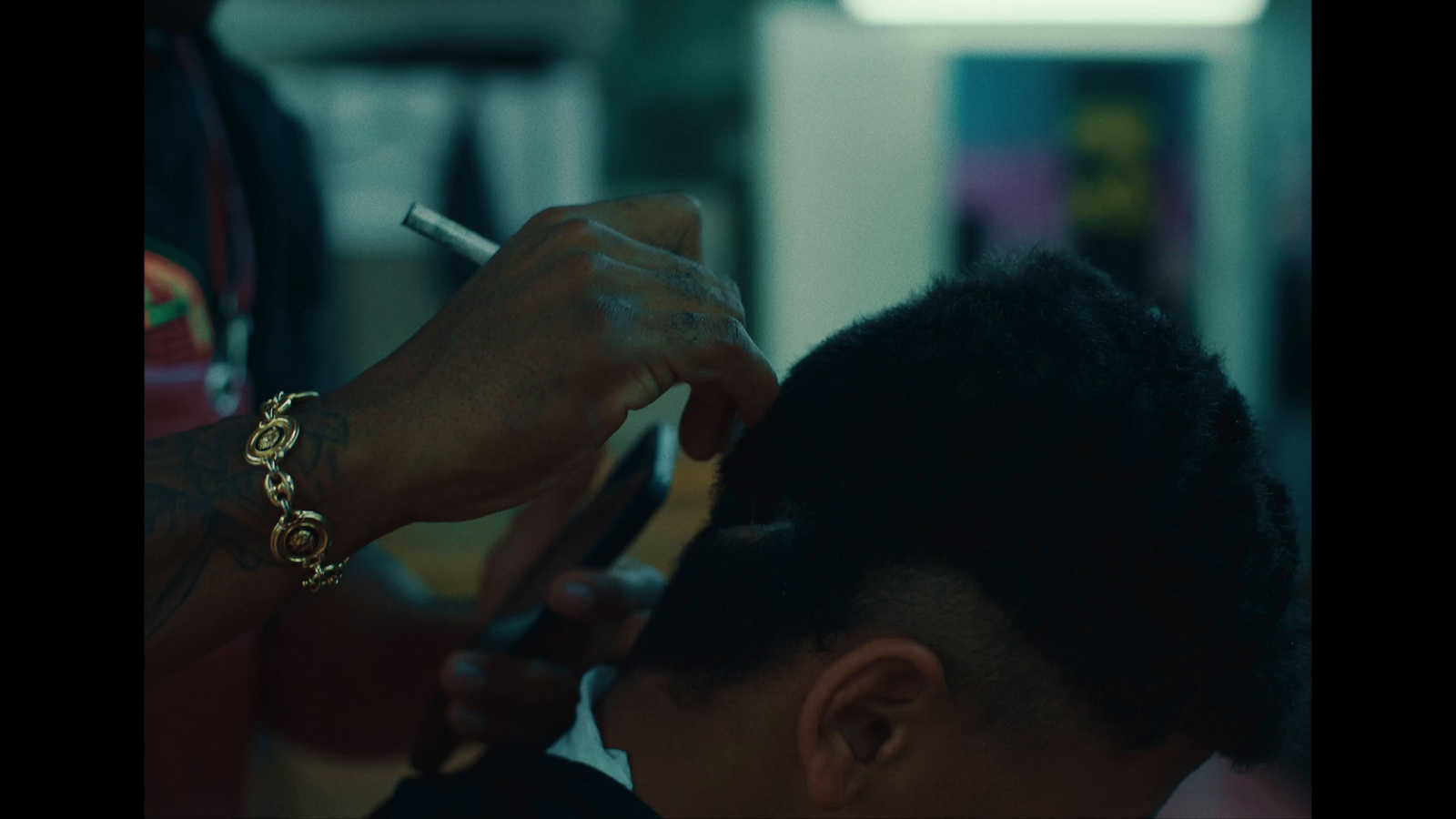 a woman is getting her hair done with a brush