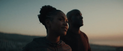 a man and a woman standing next to each other