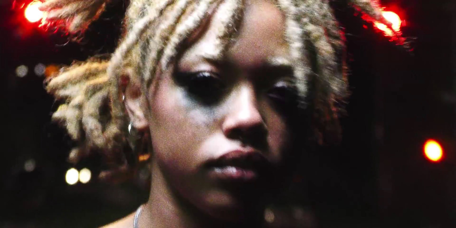 a close up of a person with dreadlocks