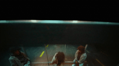 a group of people standing around in an aquarium