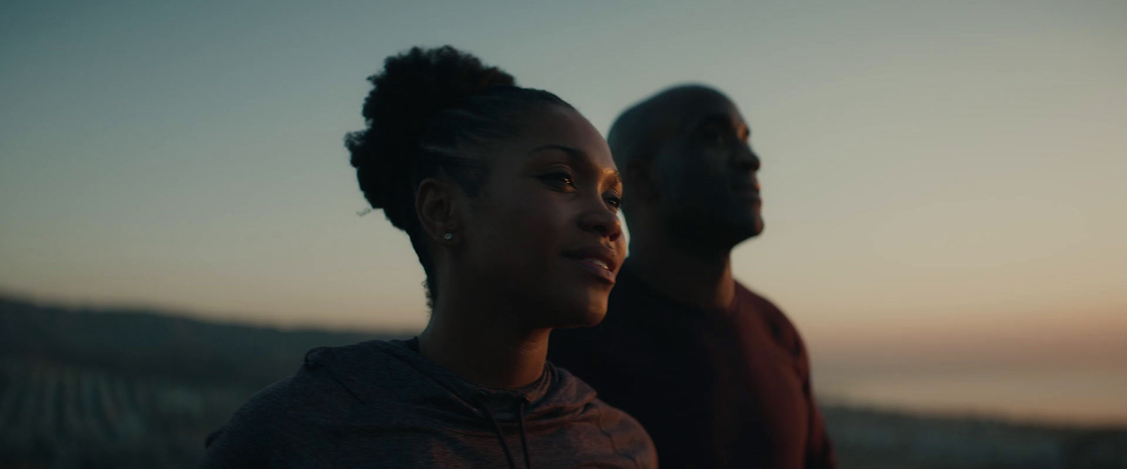 a man and a woman standing next to each other