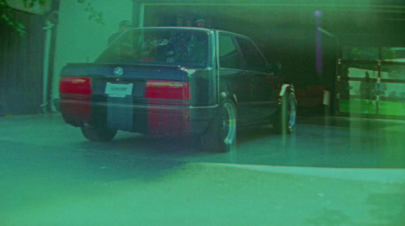 a car parked in front of a garage