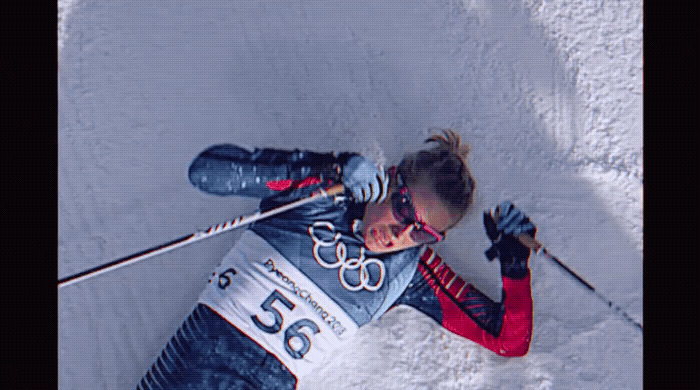 a woman is skiing down a snowy hill