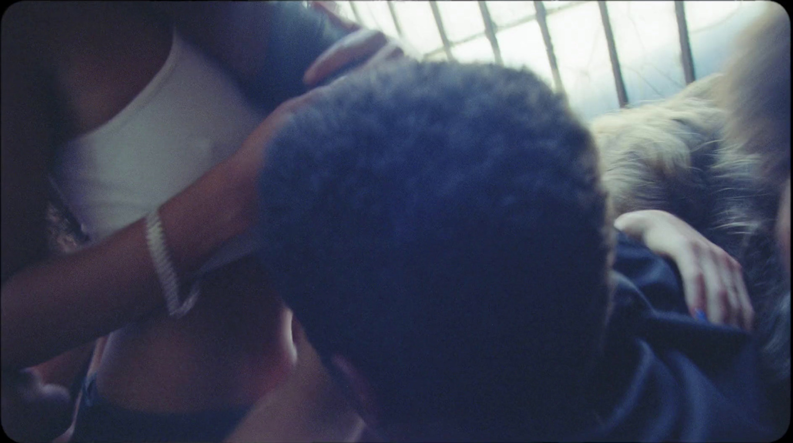 a man getting his hair cut by a woman