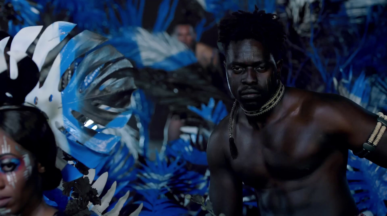 a man and a woman with painted faces and body paint