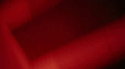 a close up of a red cloth with a black background