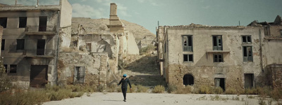 a man is walking through an old city