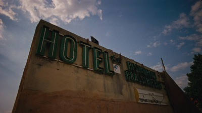 a hotel sign on the side of a building