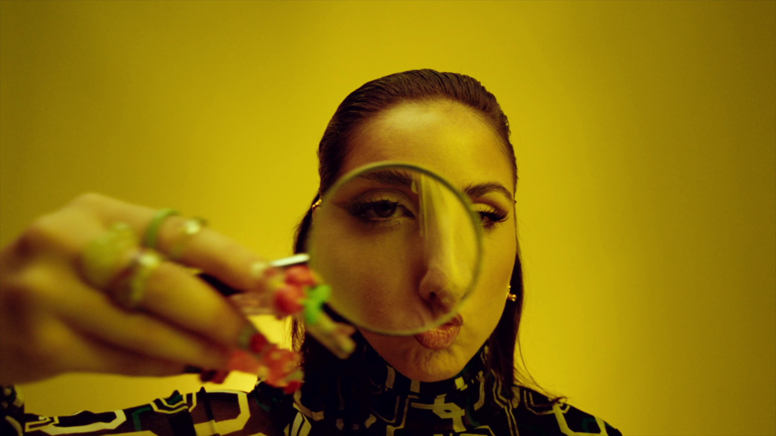 a woman looking through a magnifying glass