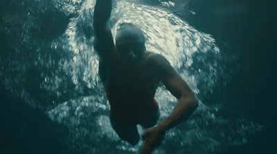 a man is swimming in the water