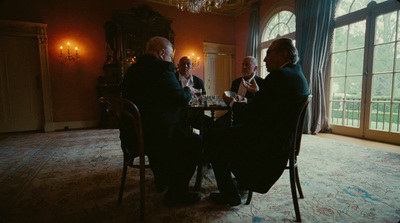 a group of men sitting around a table