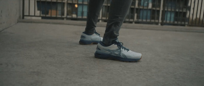 a person standing on the ground with their shoes on