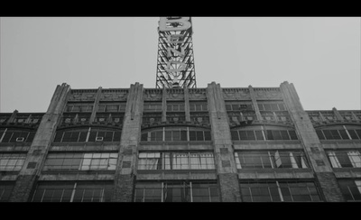 a tall building with a clock on the top of it