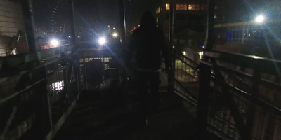 a person standing on a balcony at night