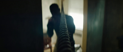 a blurry image of a person standing in a room