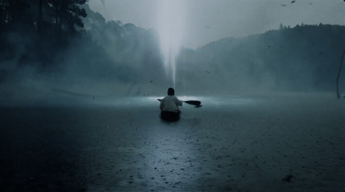 a person sitting on a boat in the water