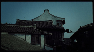 an old building with a clock on the top of it