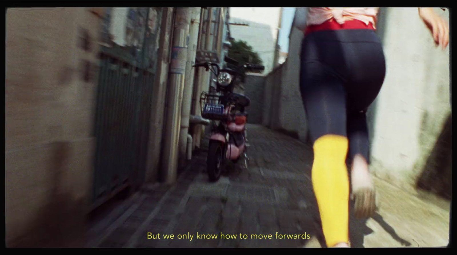 a woman in tights is running down the street