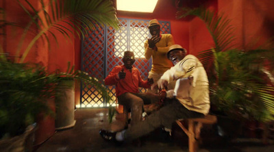 a group of men sitting on top of a bench