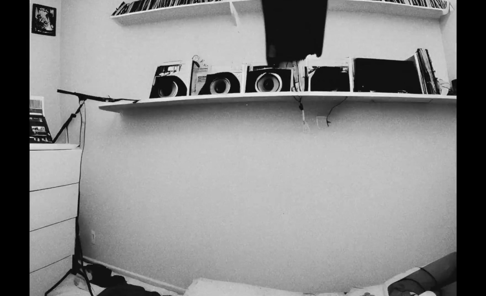 a black and white photo of a room with bookshelves