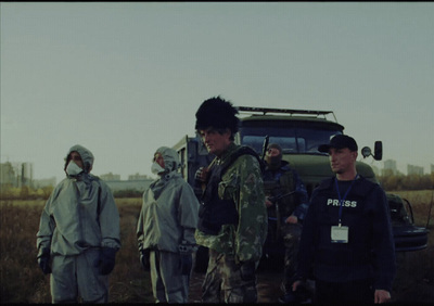 a group of people standing in a field