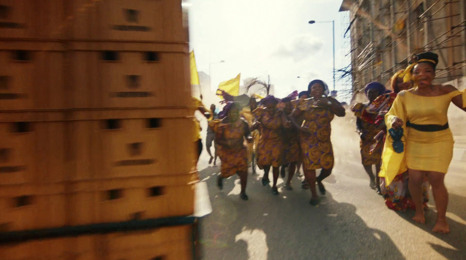 a group of people walking down a street