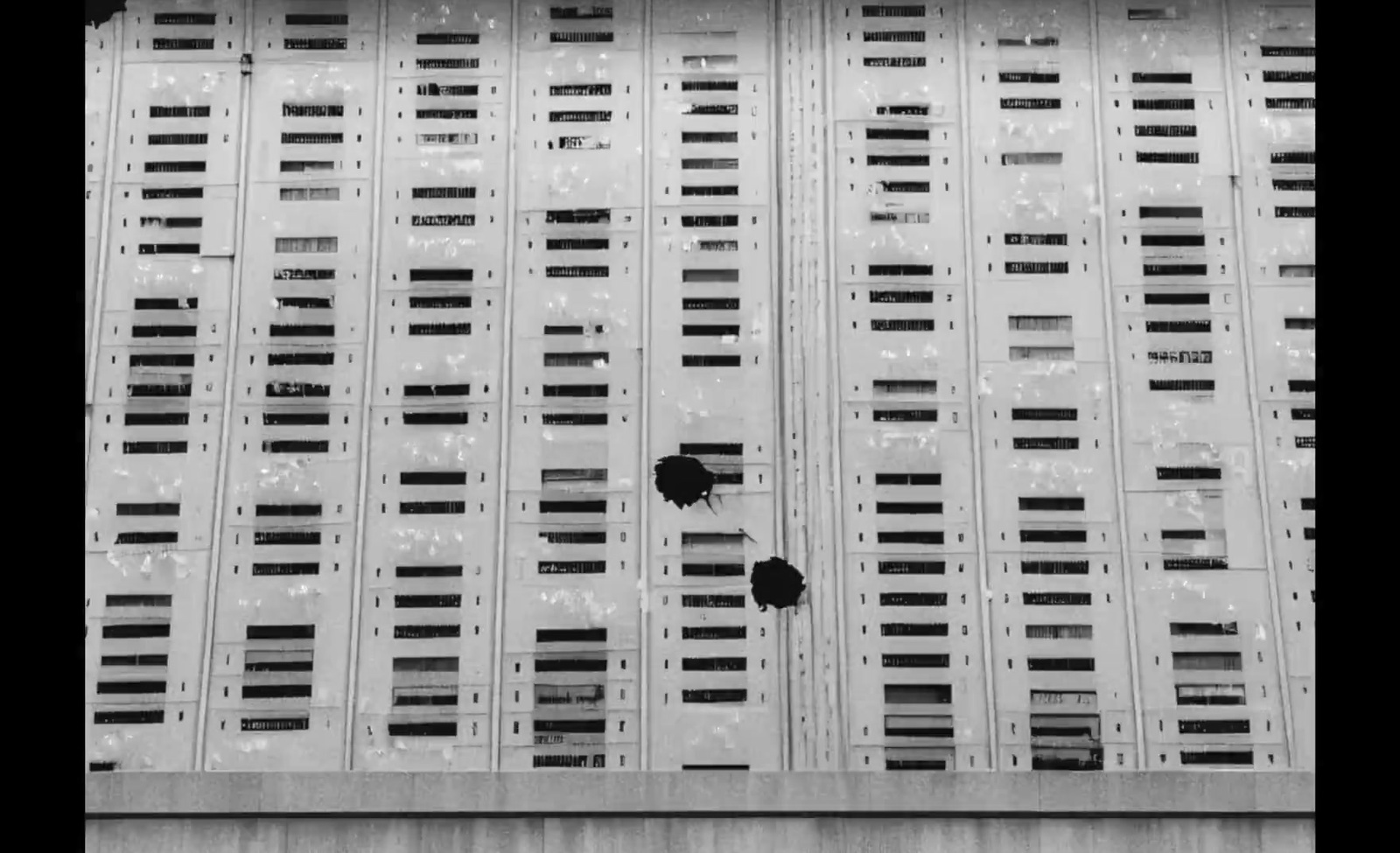 a black and white photo of a tall building