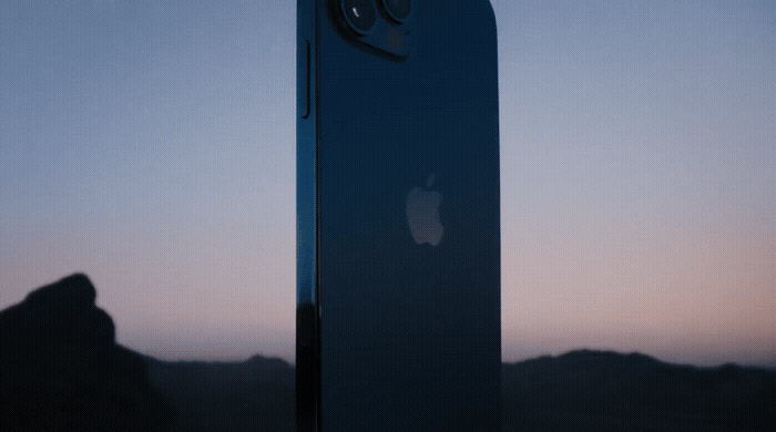 the back of an iphone with a mountain in the background