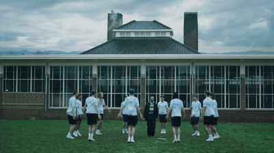 a group of people standing in front of a building