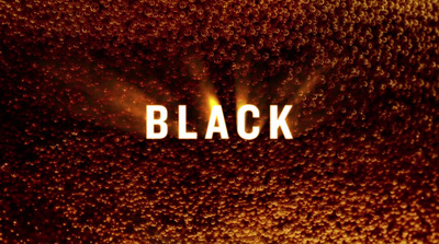 a close up of the word black on a dark background