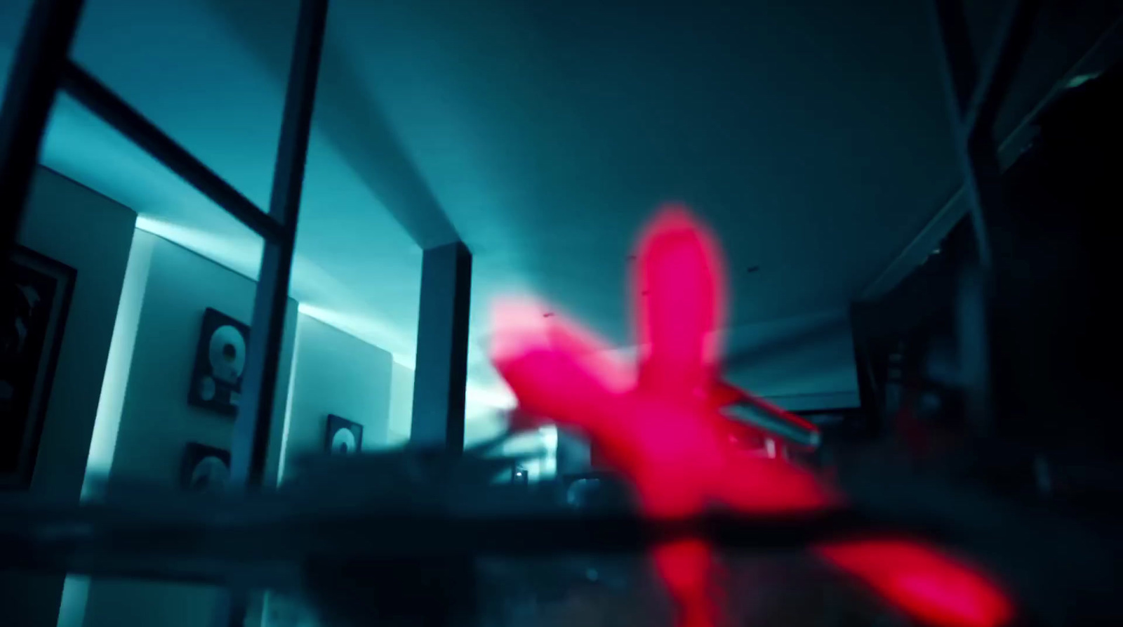 a blurry image of a red object in a room