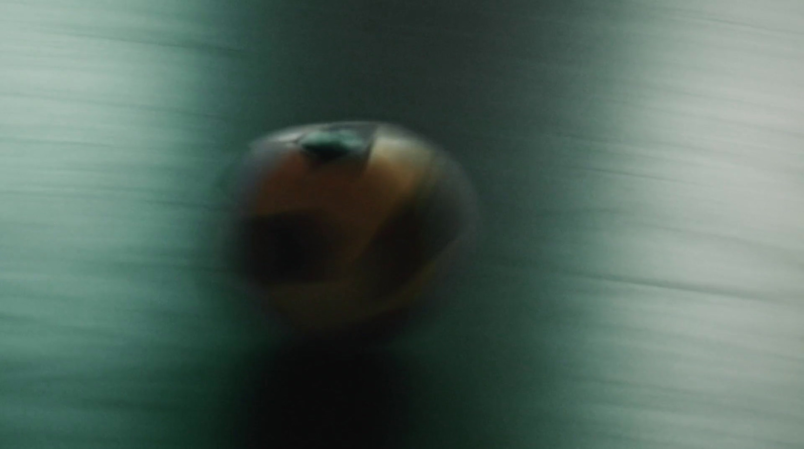 a blurry photo of a ball on a table