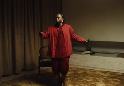 a man standing in a room with a chair